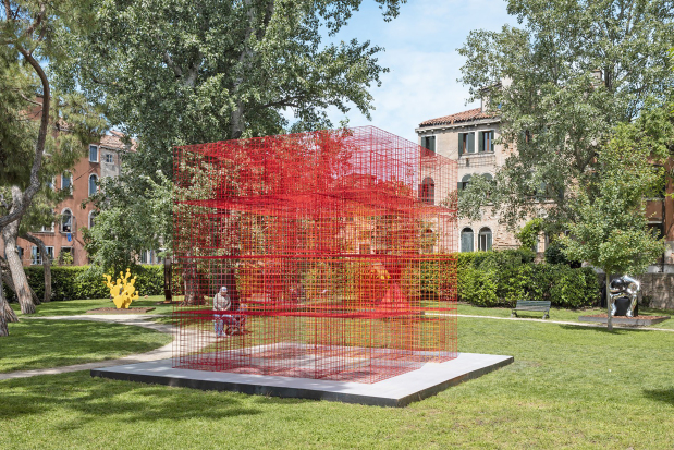 <p>Prominent artist Shaikh Rashid bin Khalifa Al Khalifa inaugurated his participation in Italy&rsquo;s renowned 61st International Art Exhibition of La Biennale di Venezia with the unveiling of his monumental installation, Guarding the Passage, to an audience of leading art critics, cultural figures and international media representatives.</p>
<p>The installation&rsquo;s vivid red hue symbolises sovereignty, resilience and Bahrain&rsquo;s national identity, while its open-mesh structure evokes values of freedom, openness and cross-cultural dialogue.</p>